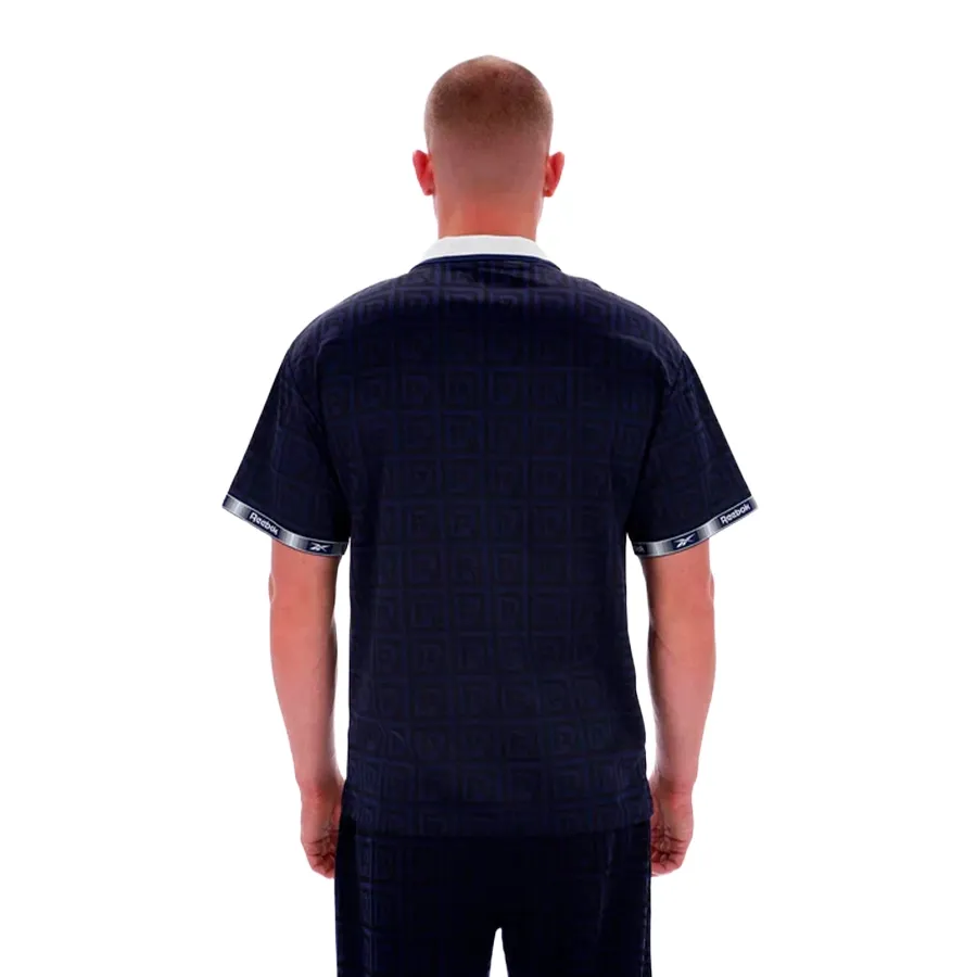 Imagen 1 de 3 de Remera Reebok Polo  Monogram Football-MARINO/NEGRO