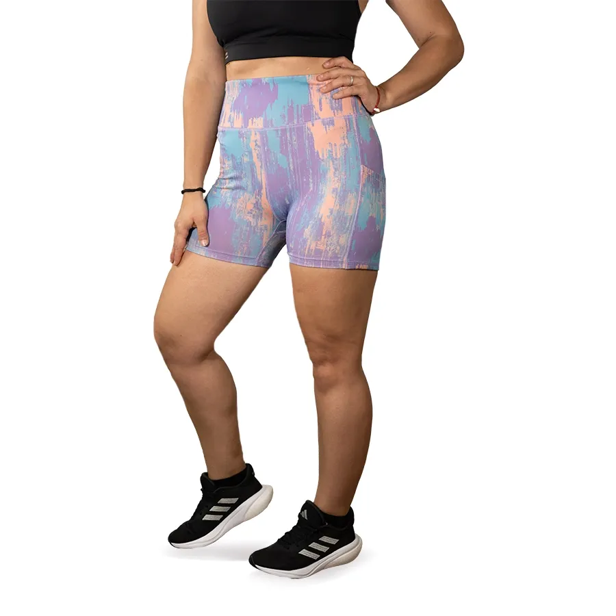 Imagen 0 de 3 de Calza Kamp Sublimada Corta-LILA/CELESTE/CORAL