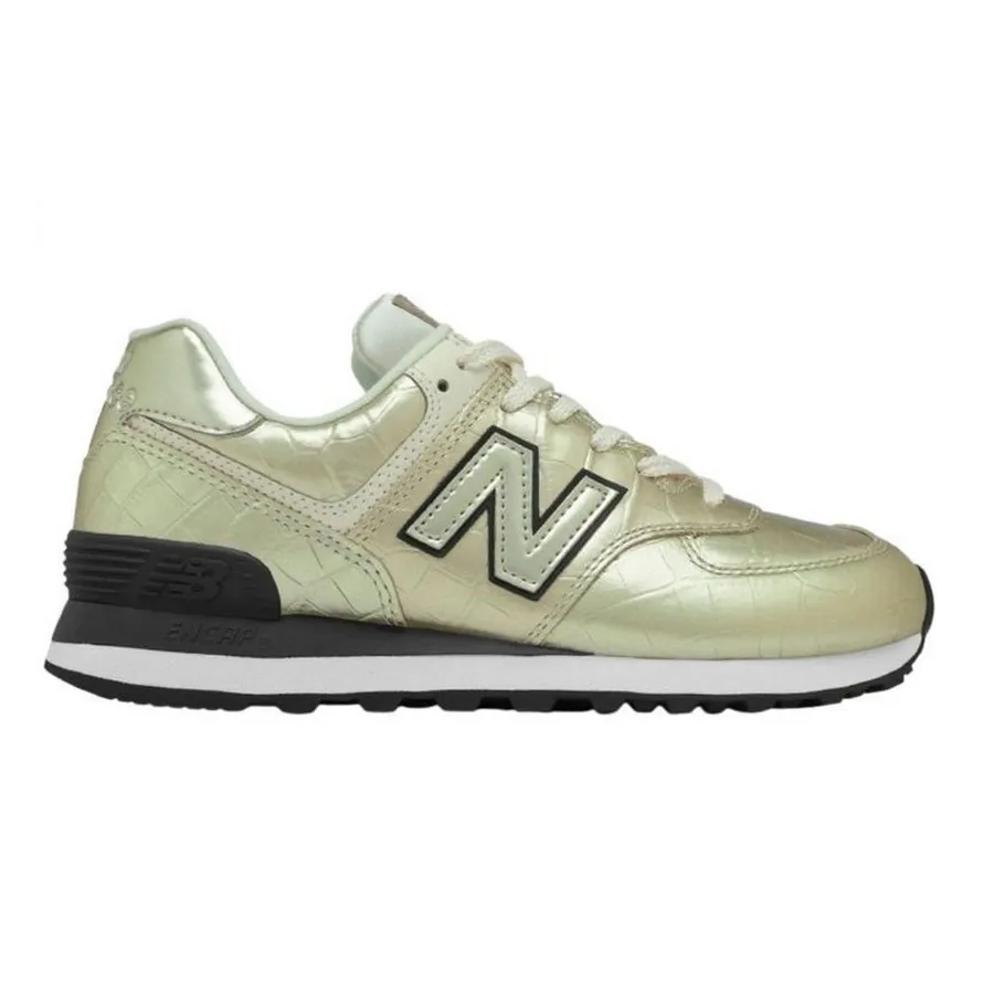 Imagen 0 de 5 de Zapatillas New Balance 574-DORADO/NEGRO