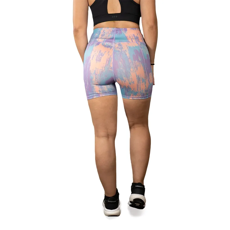 Imagen 2 de 3 de Calza Kamp Sublimada Corta-LILA/CELESTE/CORAL