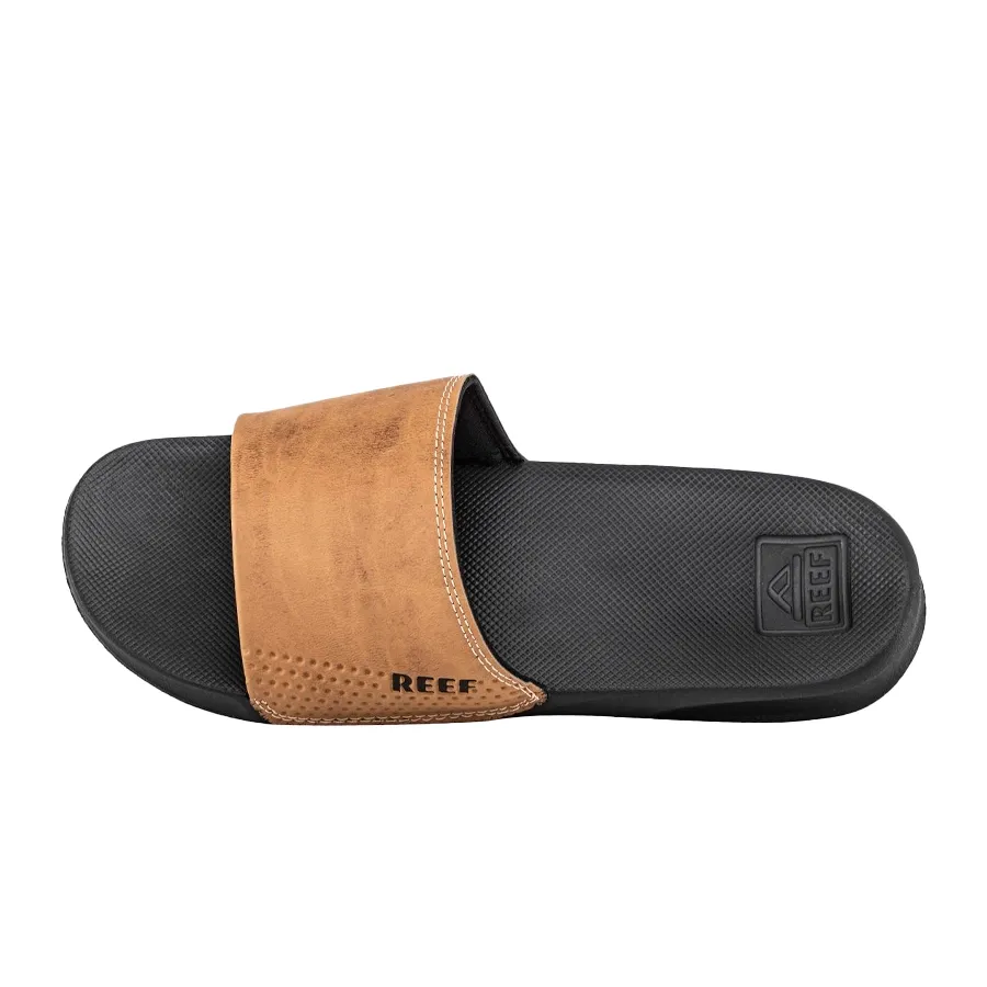 Imagen 1 de 5 de Ojotas Reef Leather Slide Ul-NEGRO/BRONCE
