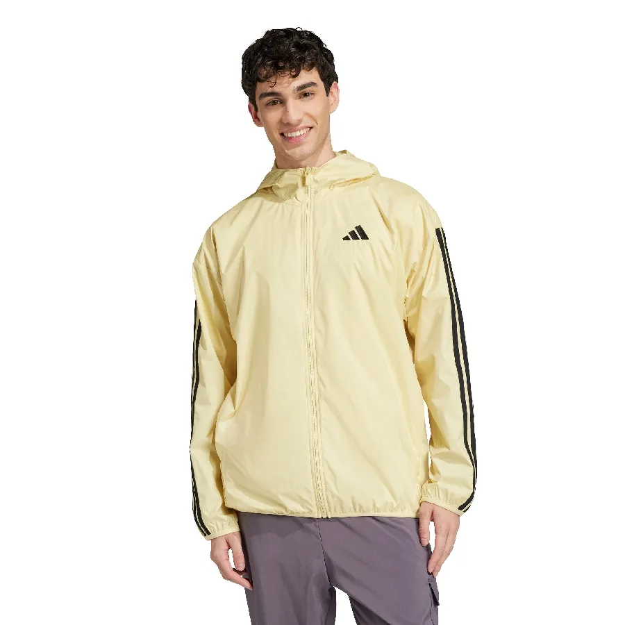 Imagen 0 de 4 de Campera adidas Rompevientos Essentials 3 Tiras-AMARILLO PASTEL
